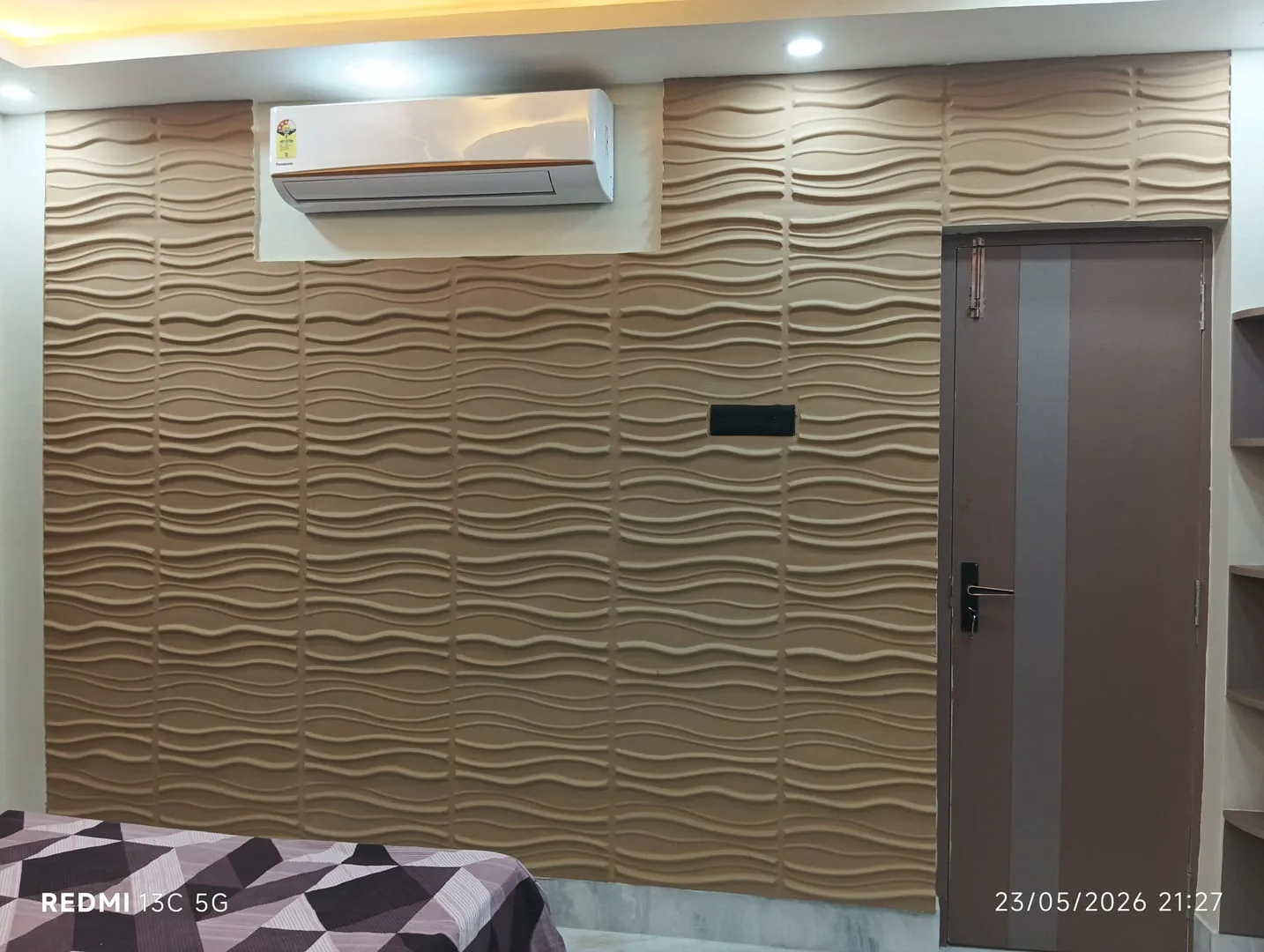 Bedroom interior with accent wall and wardrobe storage