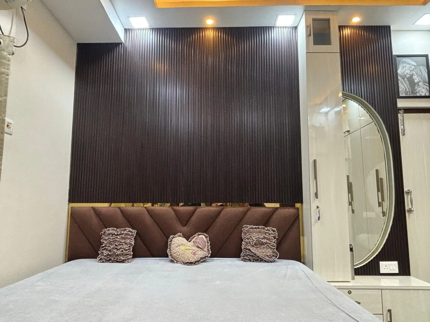 Elegant bedroom interior with customized storage and ceiling lighting