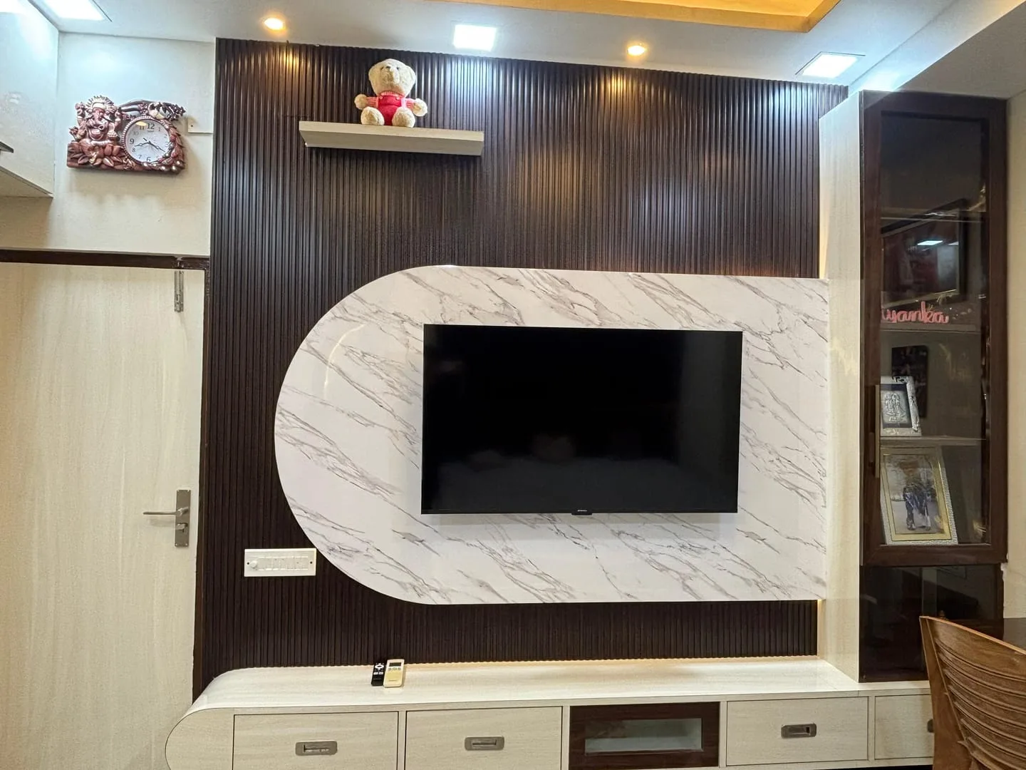 Custom TV unit and living room feature wall by Vastu Vista Interiors